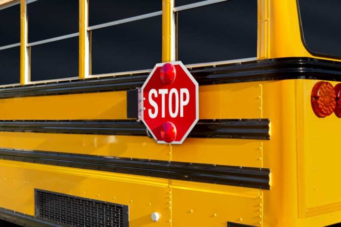 Stop,Sign,At,The,Rear,Part,Of,A,School,Bus