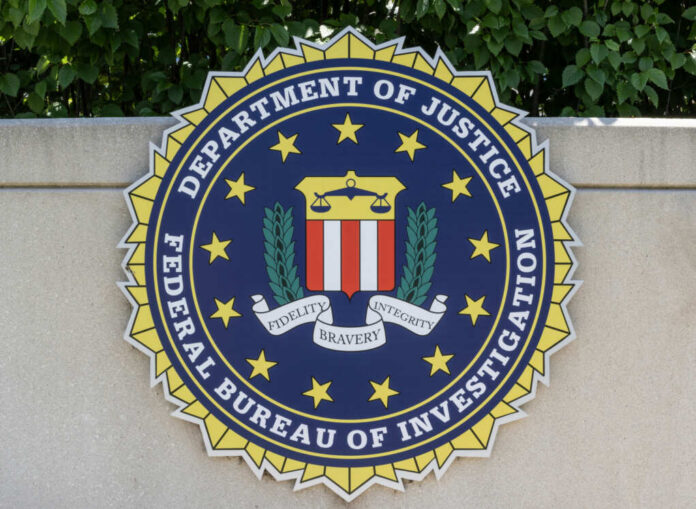 FBI seal featuring the Department of Justice emblem on a wall