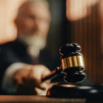 Trump-Appointed Judges Lead Anti-ICE Rebellion A judge holding a gavel in a courtroom setting