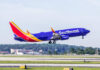 A Southwest Airlines airplane taking off from an airport runway