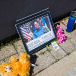 DOJ DROPS Charges – Breonna Taylor Case Twist Memorial tribute with a photo, flowers, and a candle