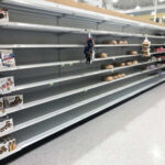 Global Food Crisis: Are We DOOMED? Empty grocery store shelves with a few snack items remaining