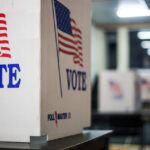 Senate Control at Stake: Texans Decide GOP’s Future Voting booths with American flags in a polling station