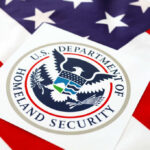 National Security HELD HOSTAGE—Democrats Block Critical Vote Department of Homeland Security seal on an American flag background