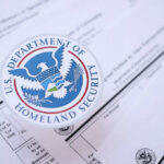 SHOCKING: DHS Deals Unveiled – Taxpayer Money Misused? Close-up of U.S. Department of Homeland Security seal on official documents