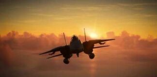 Military aircraft flying against a sunset backdrop