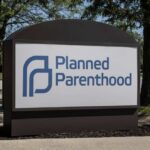 Medicaid Cuts Trigger Major Planned Parenthood Shift Sign for Planned Parenthood outside a healthcare facility