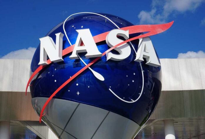 NASA logo displayed on a large blue globe against a clear sky