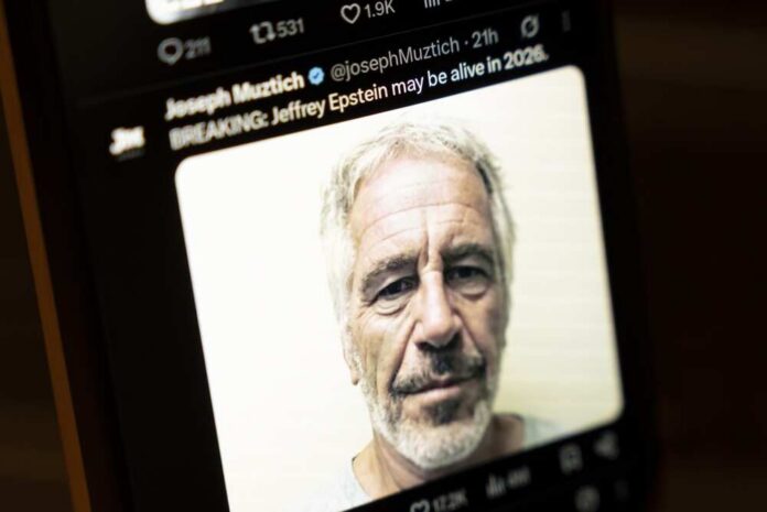 Close-up of a man's face displayed on a smartphone screen with a news headline