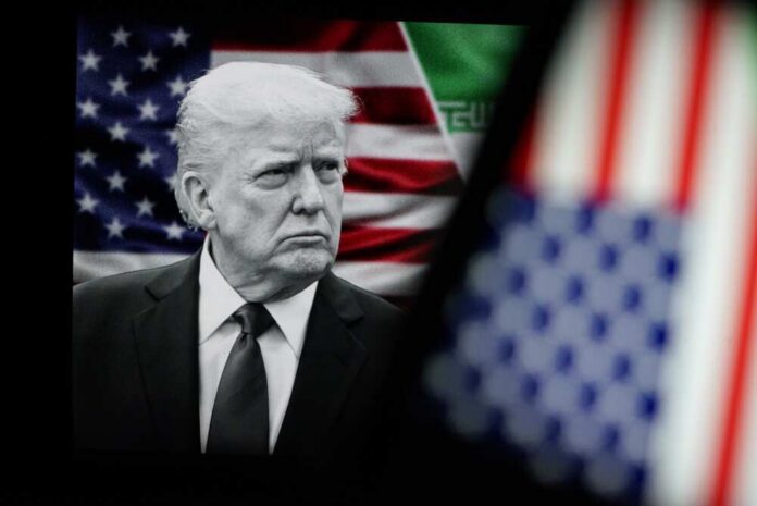 shutterstock_2742718869.jpg Donald Trump in front of an American flag, displaying a serious expression