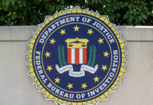 FBI seal featuring the Department of Justice emblem on a wall