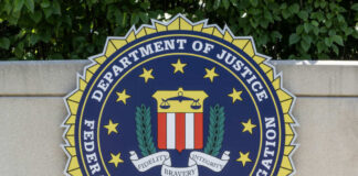 FBI seal featuring the Department of Justice emblem on a wall