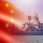 Deadly Deception: China’s Floating Missile Factories A Chinese warship sailing in the ocean with the Chinese flag in the foreground