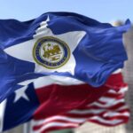 Houston city flag waving in front of other flags