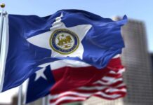 Houston city flag waving in front of other flags