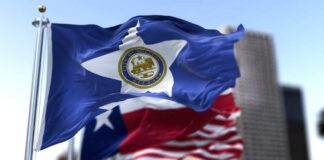 Houston city flag waving in front of other flags