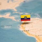 Map of South America with a flag pin marking Ecuador