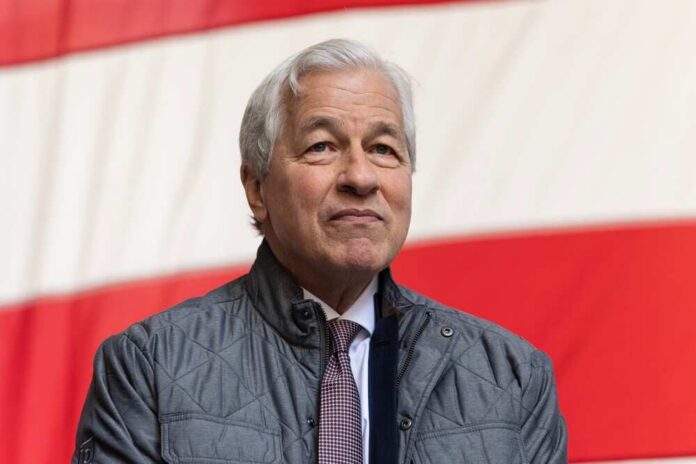 A business leader standing in front of an American flag