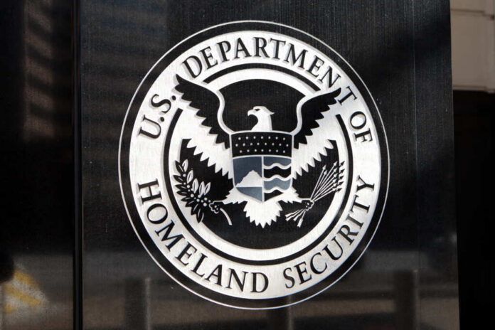 shutterstock_253261450.jpg Seal of the U.S. Department of Homeland Security displayed on a building