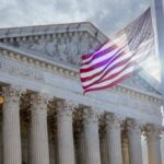 Trump’s Next SCOTUS Picks: Loyalists or Traditionalists? The Supreme Court building with an American flag waving in front