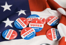 Voting buttons on an American flag background