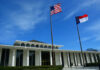 Digital Snooping Explodes in ‘Homewrecker’ Cases Government building with American and North Carolina flags under a clear blue sky