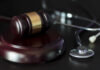 Texas Doc’s Shocking Pill Scheme: Unbelievable! A gavel and a stethoscope on a dark surface