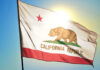 Fear Grows Over California’s Religious Holiday Mandate California state flag waving in the sunlight
