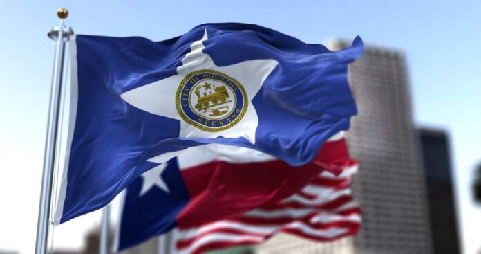 Houston,City,Flag,Waving,In,The,Wind,With,Texas,State Houston city flag waving in front of other flags