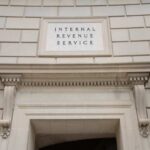 Mystery Fund To End Trump’s IRS Feud? Entrance of the Internal Revenue Service building with architectural details
