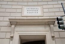 Mystery Fund To End Trump’s IRS Feud? Entrance of the Internal Revenue Service building with architectural details
