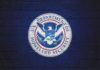 Logo of the U.S. Department of Homeland Security on a blue wall