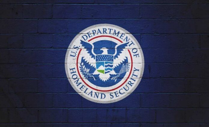Logo of the U.S. Department of Homeland Security on a blue wall