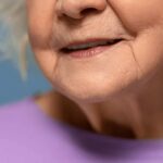 Close-up of an elderly woman's face with a gentle smile
