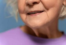 Close-up of an elderly woman's face with a gentle smile