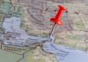 Middle East Tensions BOIL — Islands at Stake! A red pushpin on a map of the Middle East highlighting a specific location
