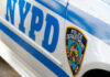 NEW Terror Threat–NYC Synagogue Targeted! Close-up of a New York Police Department vehicle showcasing the badge and blue stripes