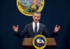 Chemical Tank Panic: Gavin Newsom Declares Emergency! California governor delivering a speech at a podium