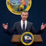 Chemical Tank Panic: Gavin Newsom Declares Emergency! California governor delivering a speech at a podium