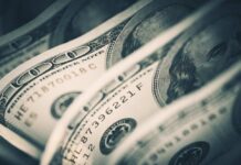 Close-up of folded hundred dollar bills
