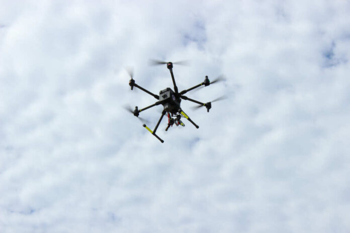 shutterstock2543741449jpg A drone flying against a cloudy sky