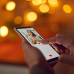 Person using a smartphone to interact with a dating app