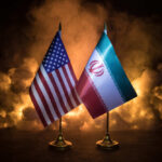 China Backs Deal, Warns Of Risks Flags of the United States and Iran displayed together