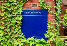 Race Rules? DOJ Turns Up Heat Sign for Yale University partially covered by ivy