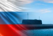 Ukraine’s New Strategy Takes Hold A submarine partially submerged in water with the Russian flag in the background