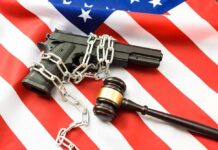 Texas Gun Law Trip-Up Hits NBA Star A handgun chained and placed on an American flag with a gavel nearby