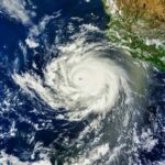 Back‑to‑Back Deluges Push Towns to Brink Satellite image of a powerful hurricane over the ocean