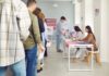 Photo ID Push Masks Bigger Move People waiting in line at a polling station to cast their votes