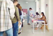 Photo ID Push Masks Bigger Move People waiting in line at a polling station to cast their votes