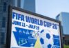 Cyber Threats Shadow World Cup FIFA World Cup 26 poster with soccer ball in urban setting